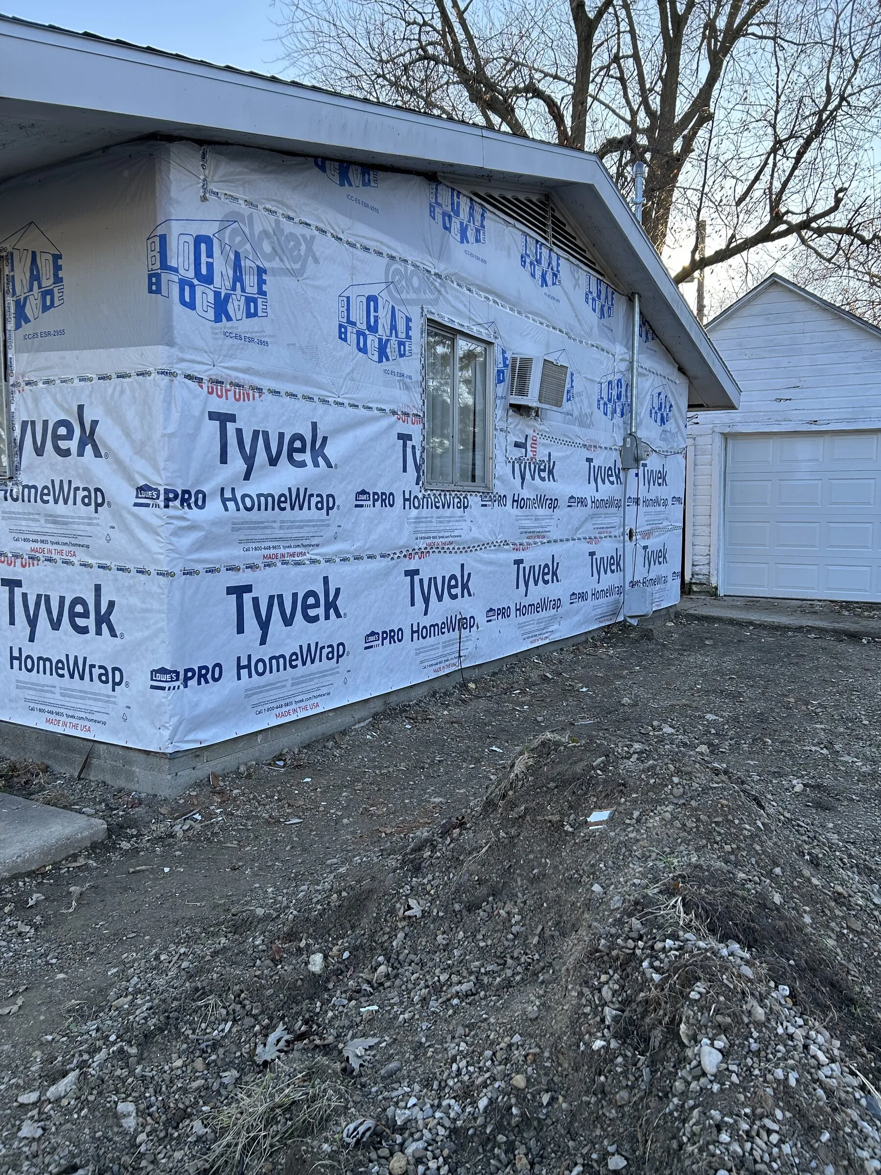 Garage siding in the process of being replaced.